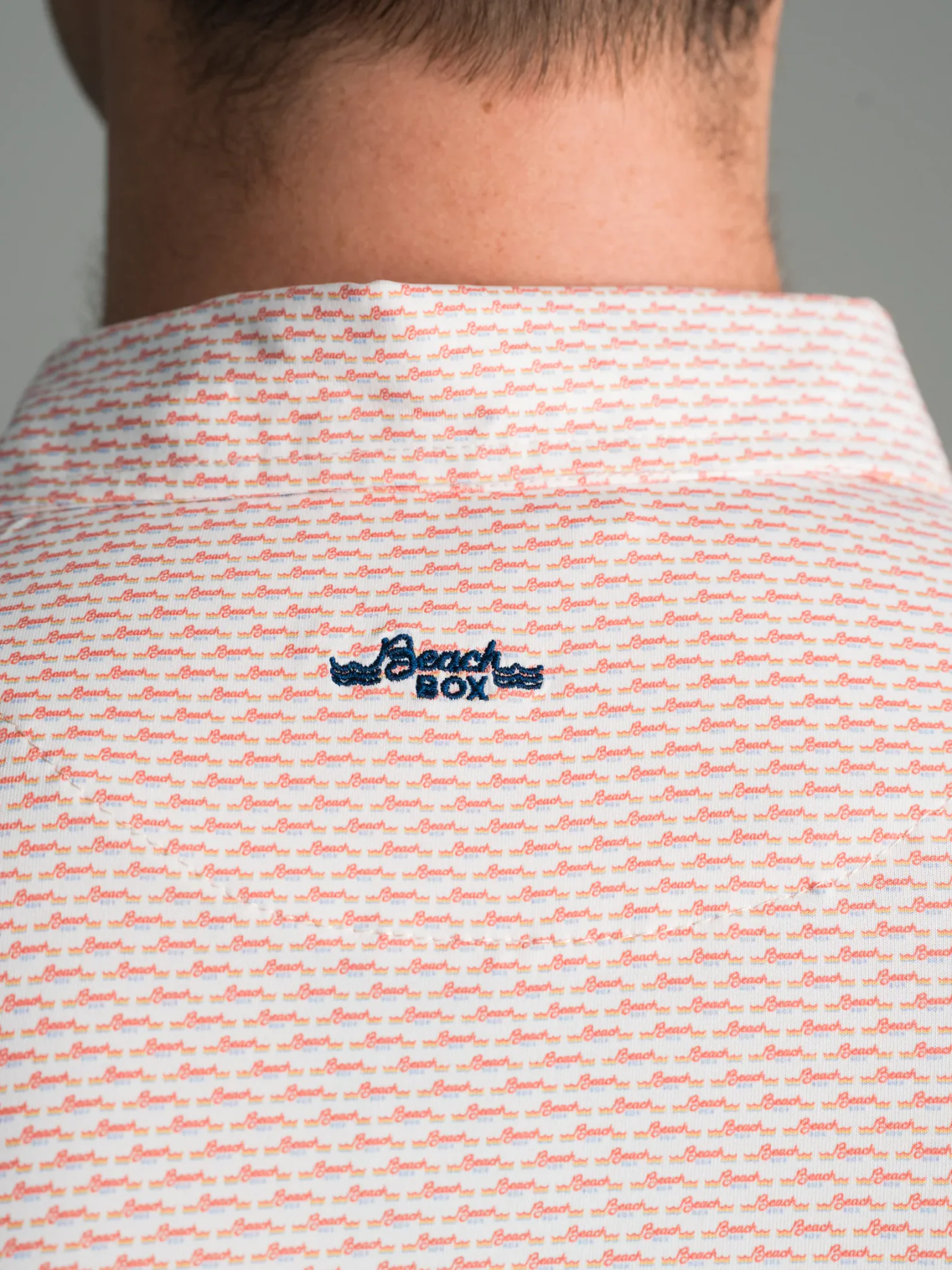 Beach Box polo with embroidered back collar branding