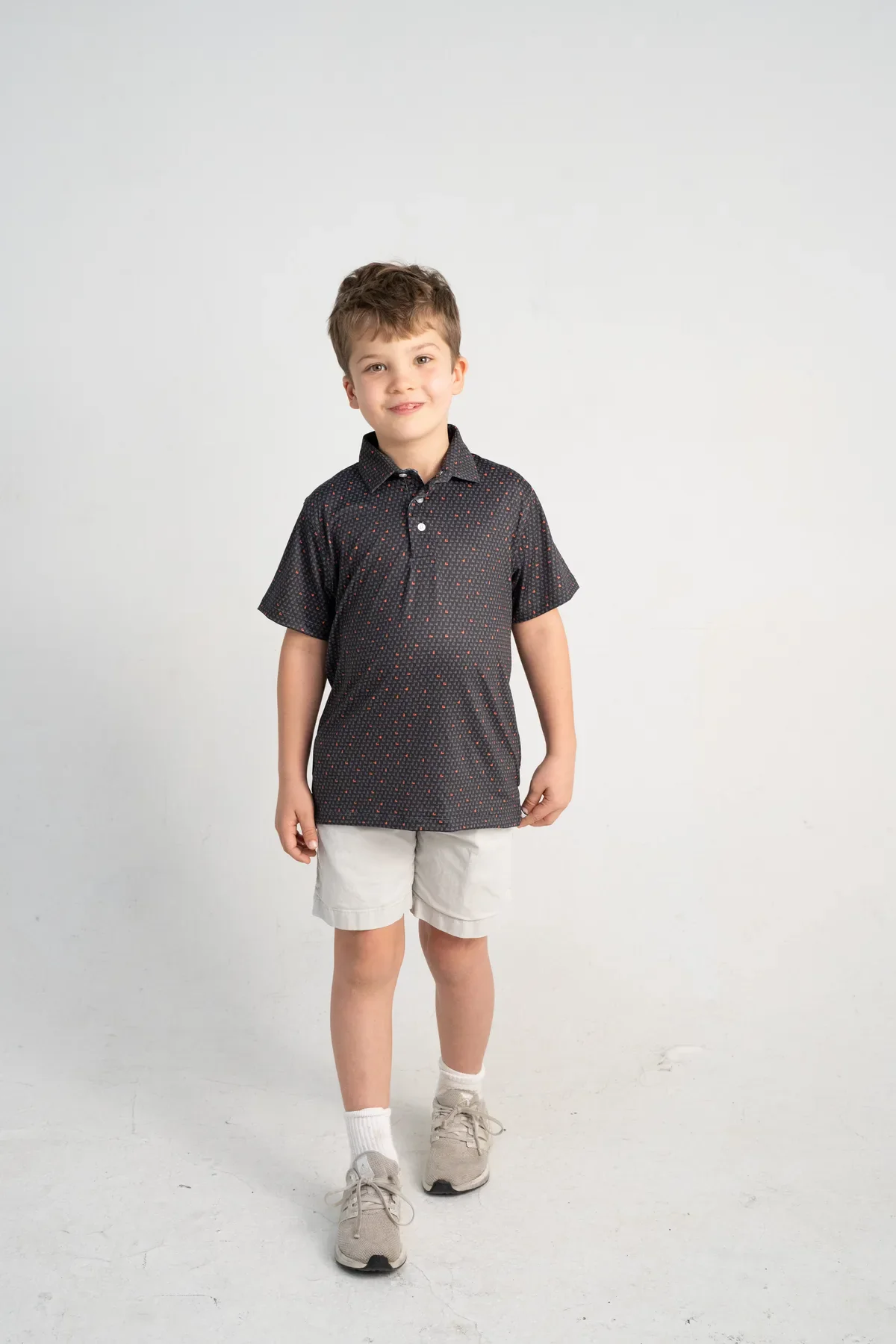 Custom Camp Ozark polo with a colorful camp icon pattern