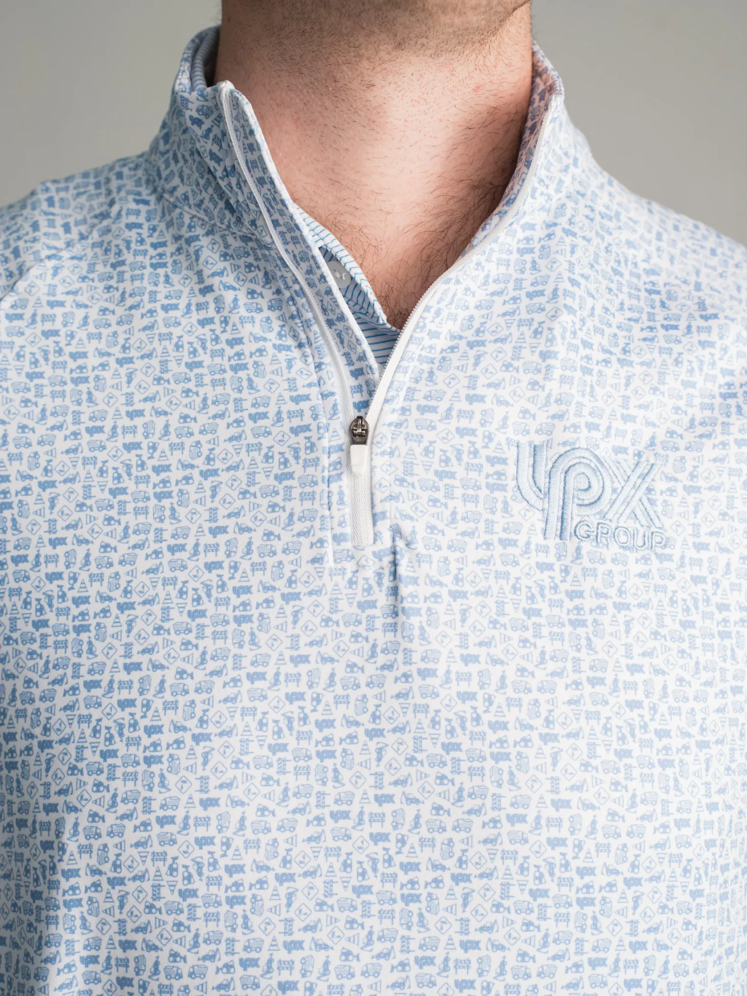 LPX Group quarter zip with a light blue branded icon pattern