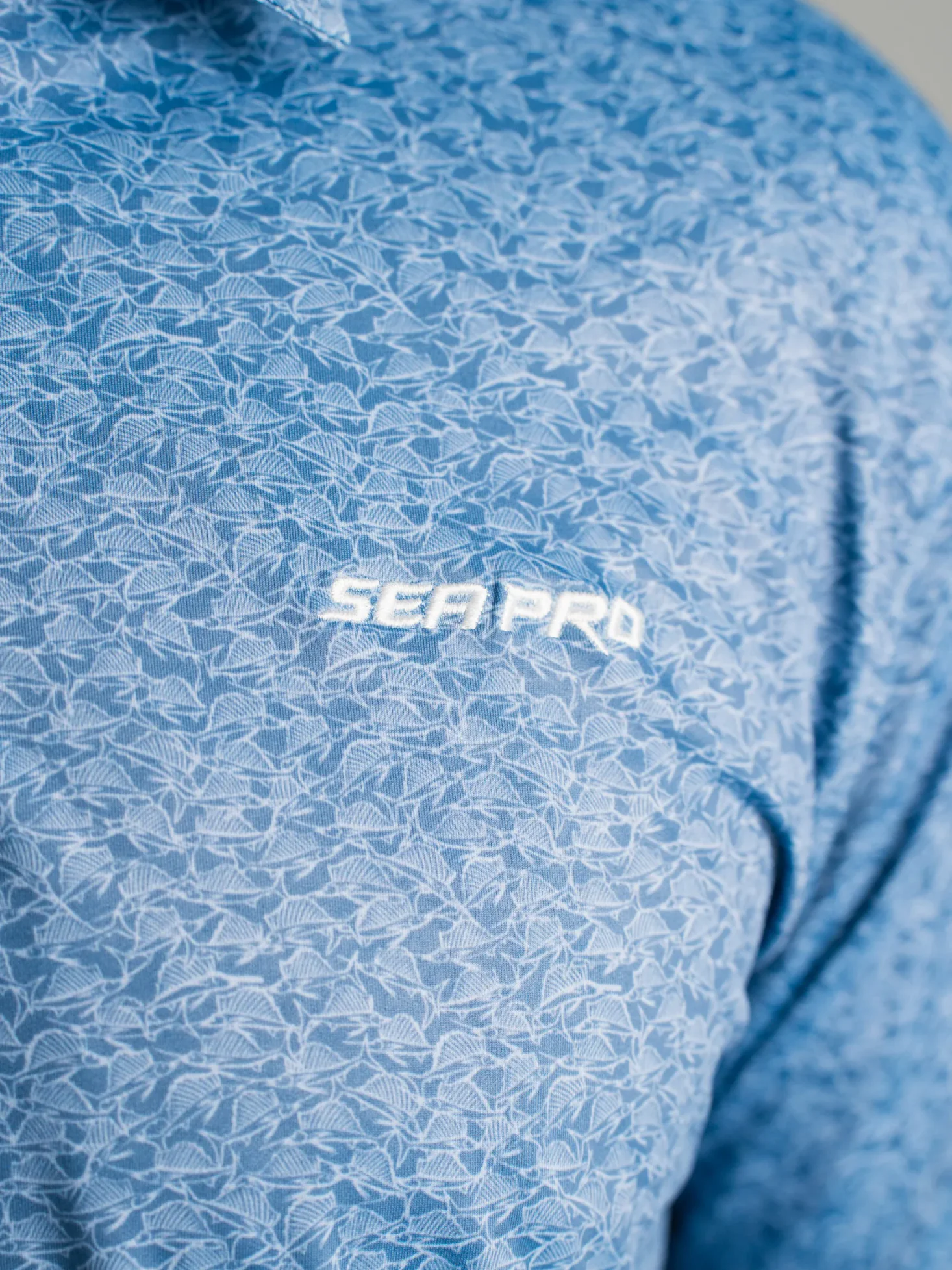 Blue Sea Pro polo with embroidered logo and marine pattern