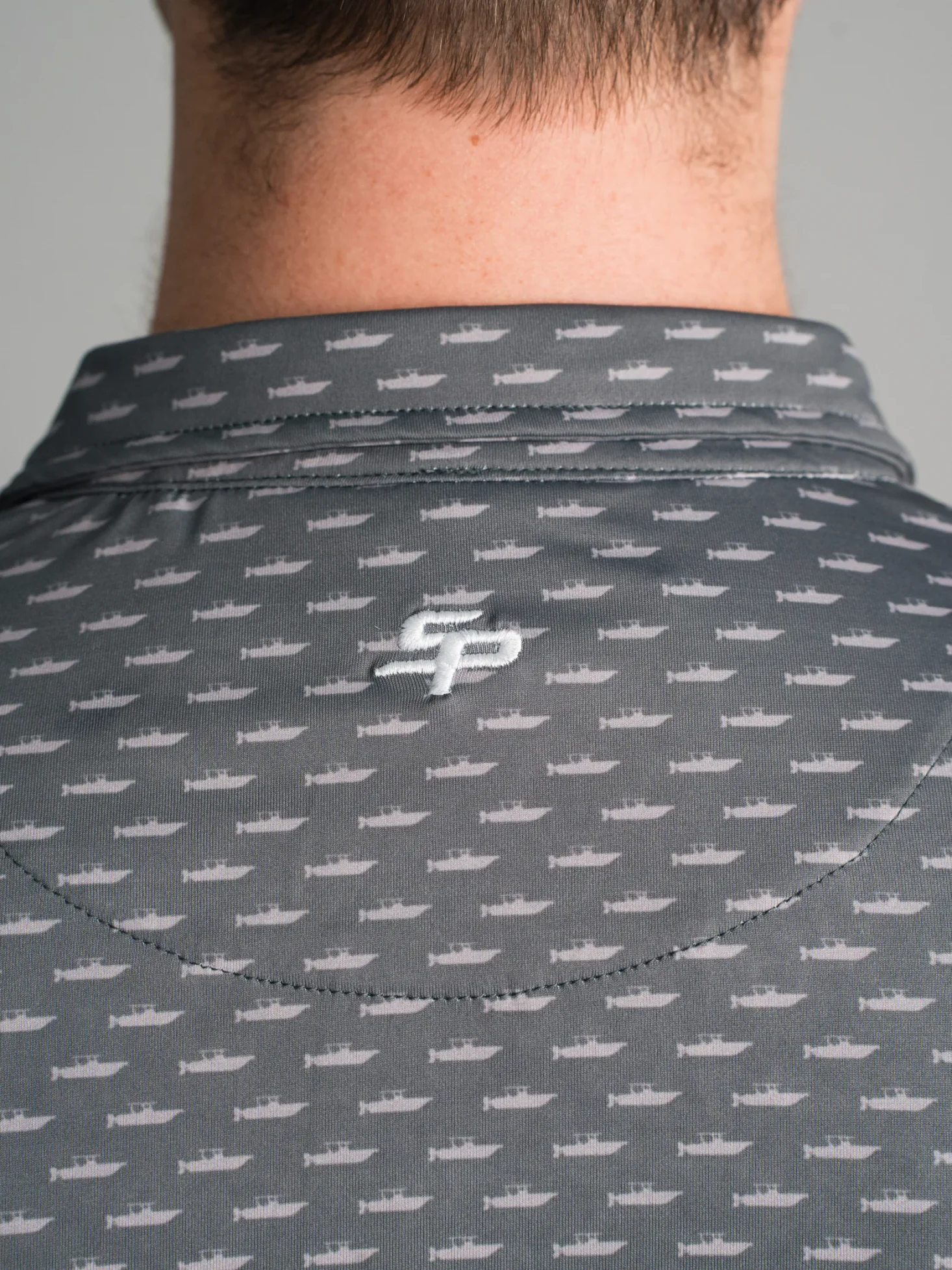 Charcoal Sea Pro polo with custom back collar embroidery