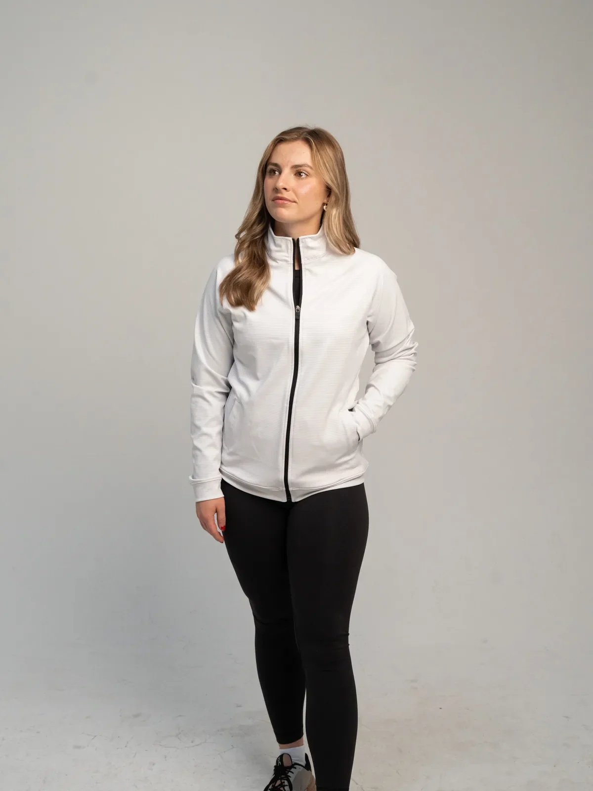White women's full zip jacket worn by a model