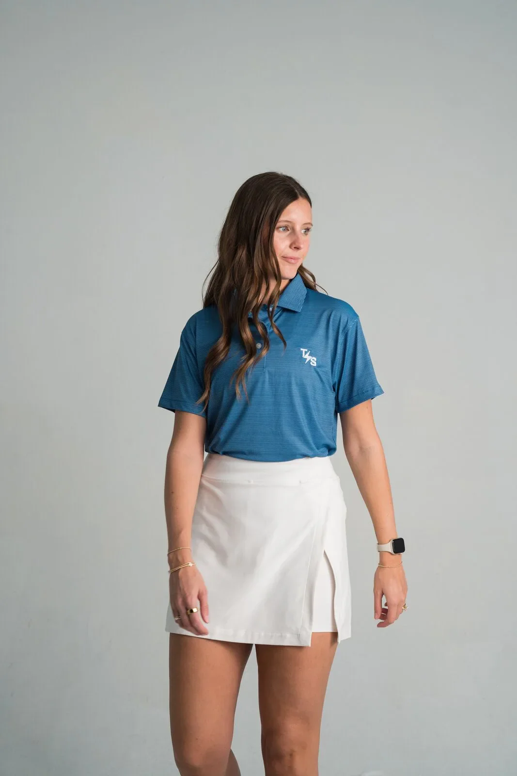 Blue embroidered polo worn by a model